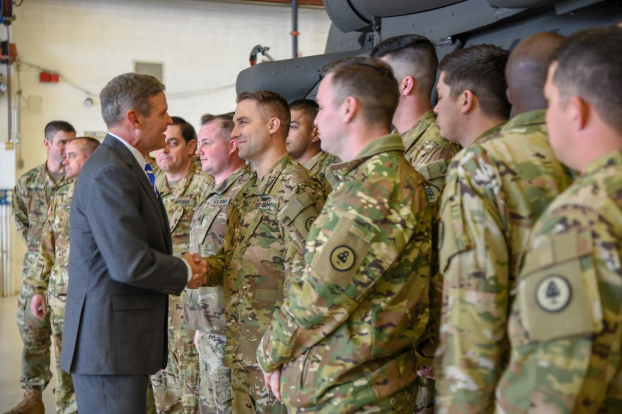 Tennessee Governor Bill Lee shakes hands with a member of the Tenn. Army National Guard’s 2-135th Aviation Regiment
